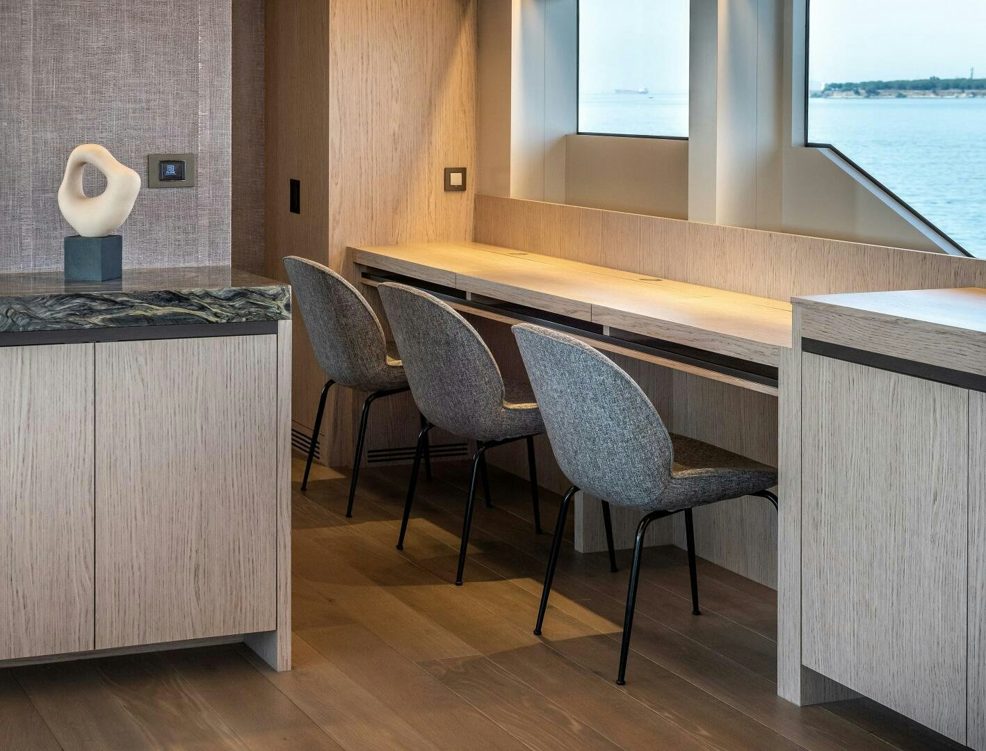 a table with chairs around it aboard 37XP 08 ROCKIT Yacht for Sale