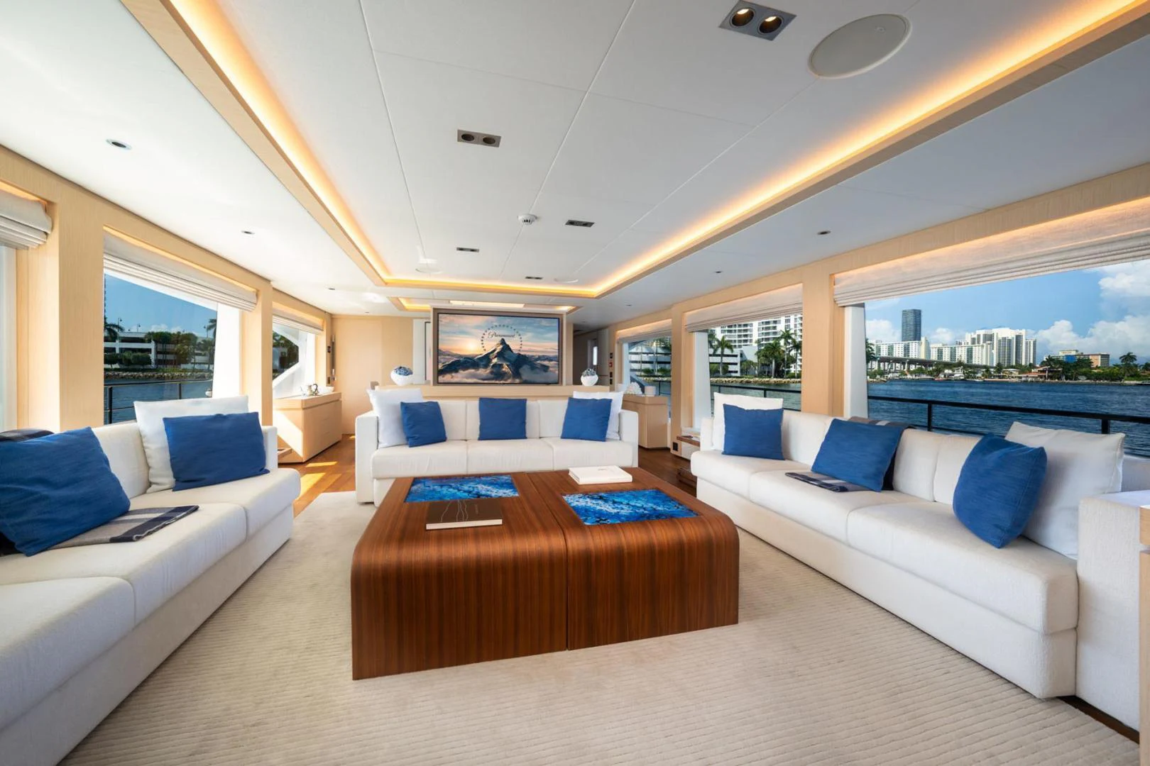 a living room with a couch and a table aboard SANTOSH Yacht for Sale