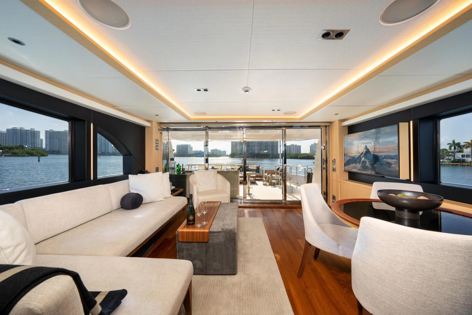 a living room with a large window aboard SANTOSH Yacht for Sale