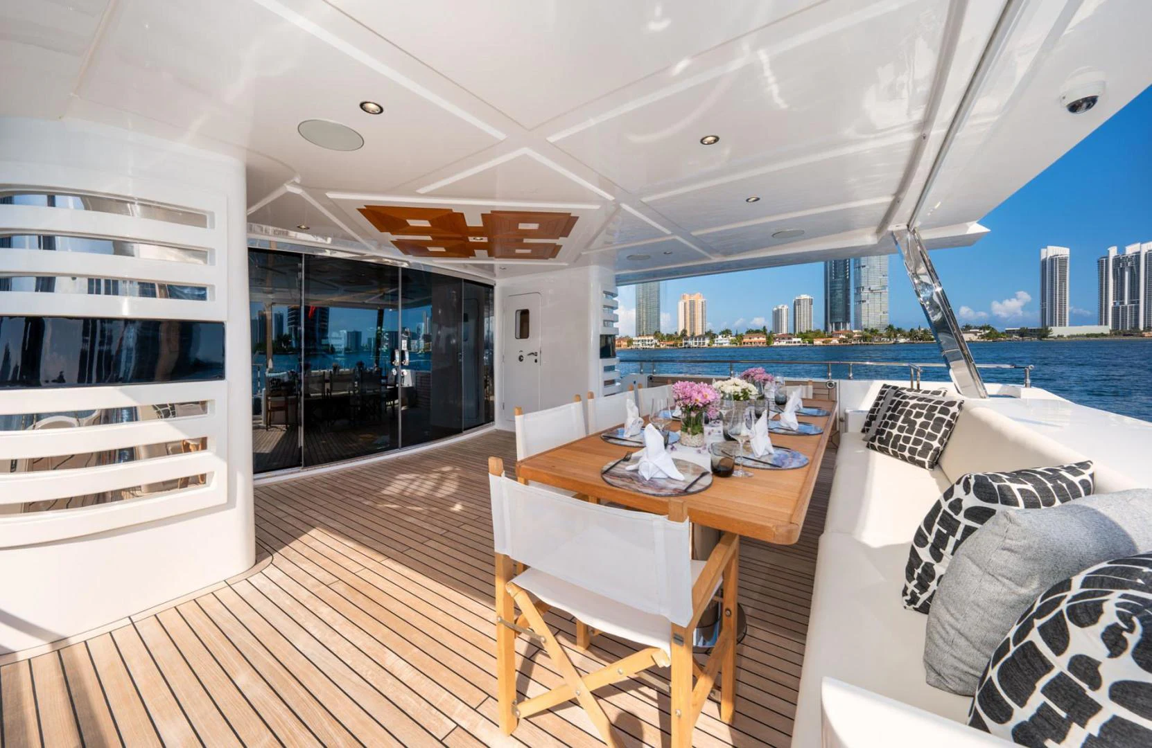 a room with a table and chairs aboard SANTOSH Yacht for Sale