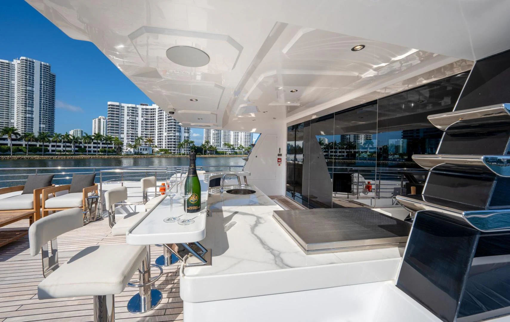 a room with tables and chairs aboard SANTOSH Yacht for Sale