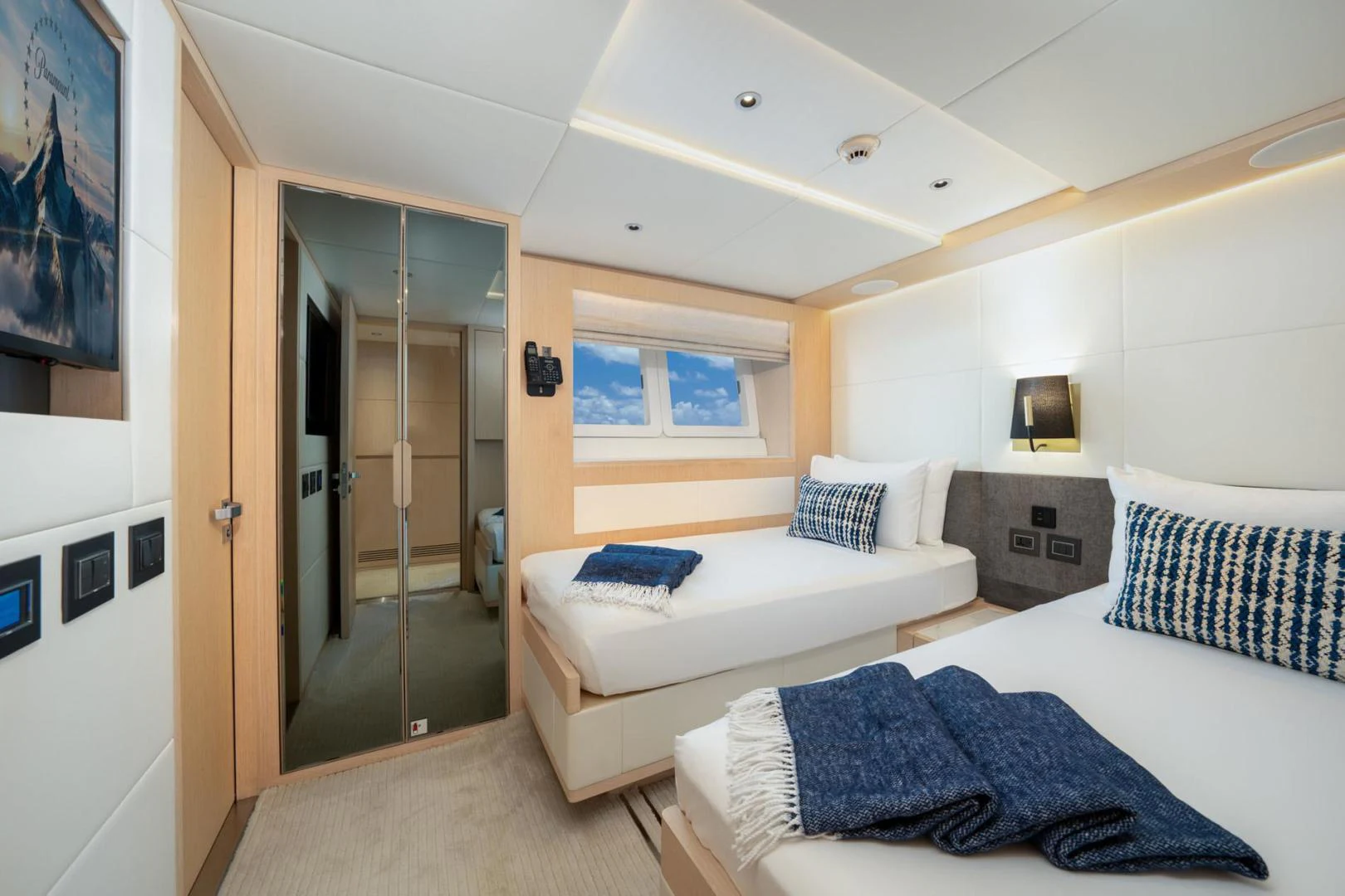 a room with a bed and a door aboard SANTOSH Yacht for Sale