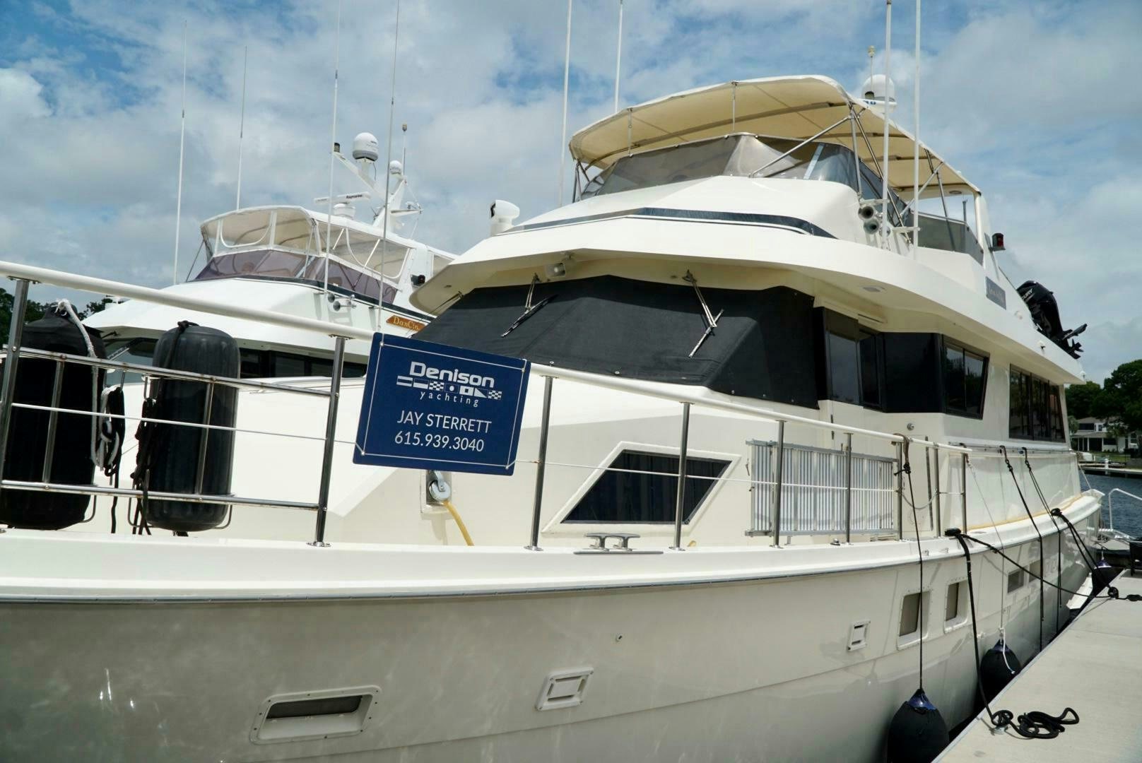 a white boat with a sign on the front aboard JOIE DE VIE Yacht for Sale