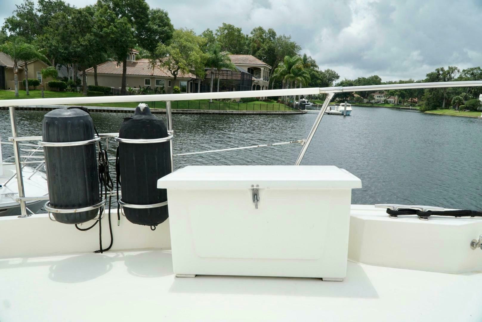 a white rectangular object with a black top on a white surface by a body of water aboard JOIE DE VIE Yacht for Sale