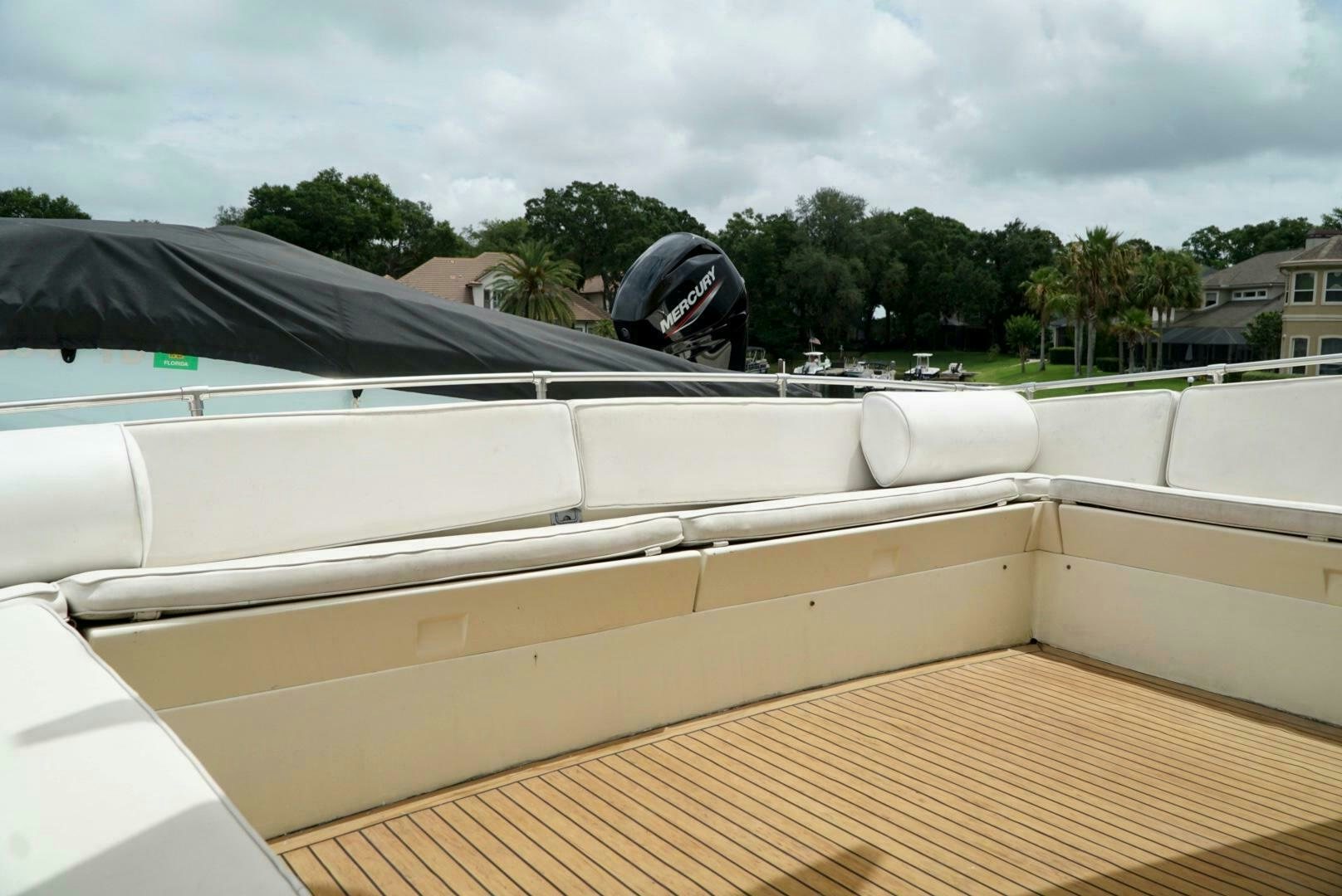 a car with a helmet on top aboard JOIE DE VIE Yacht for Sale
