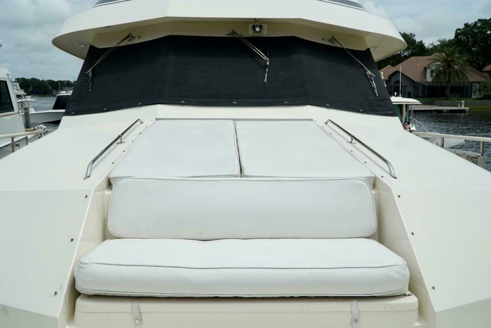 a white boat with a cover aboard JOIE DE VIE Yacht for Sale