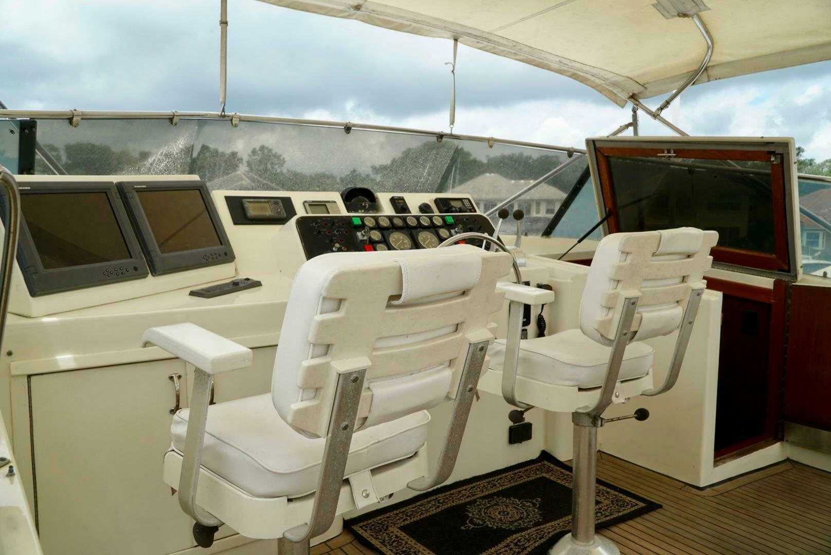 a boat with a desk and chairs aboard JOIE DE VIE Yacht for Sale