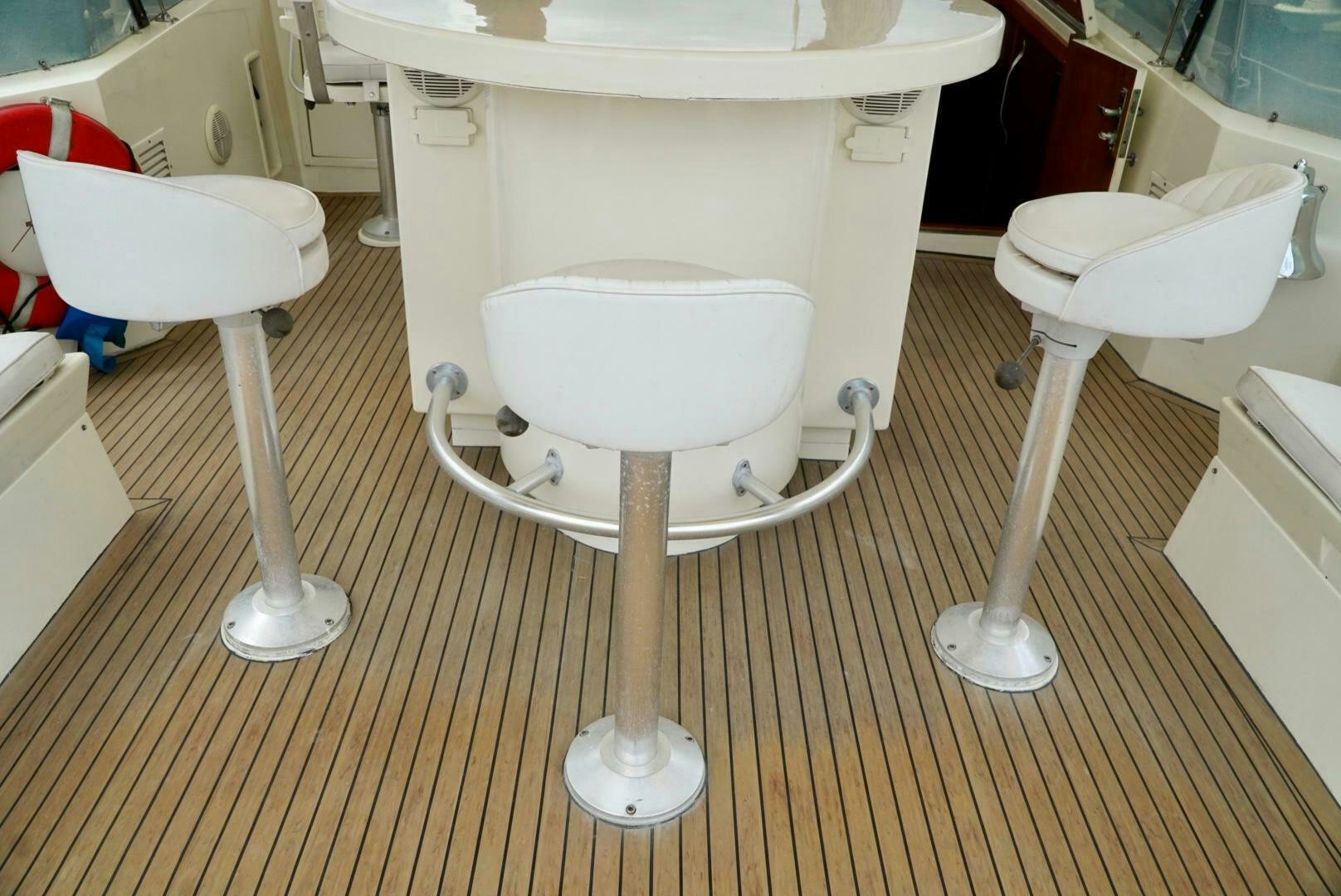 a white chair and a white table aboard JOIE DE VIE Yacht for Sale