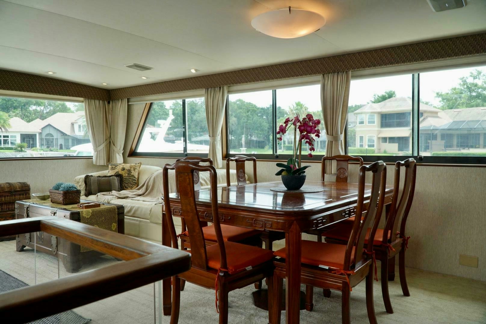 a dining table in a living room aboard JOIE DE VIE Yacht for Sale