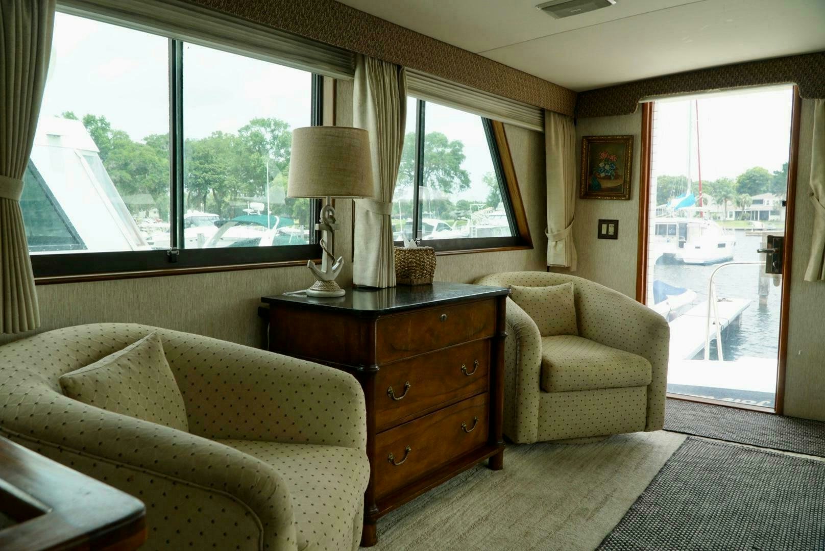 a living room with a large window aboard JOIE DE VIE Yacht for Sale