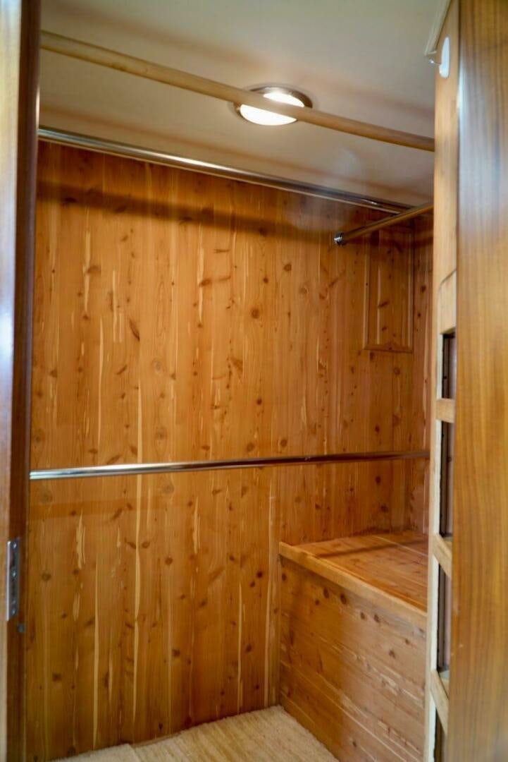 a wooden room with wood walls aboard JOIE DE VIE Yacht for Sale