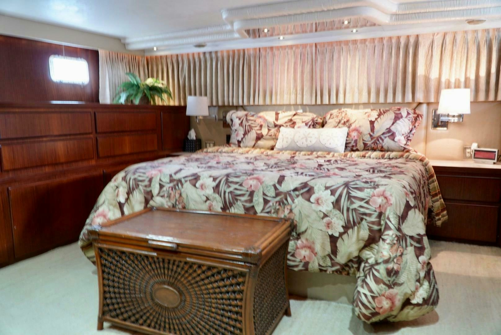 a bed with a large headboard aboard JOIE DE VIE Yacht for Sale