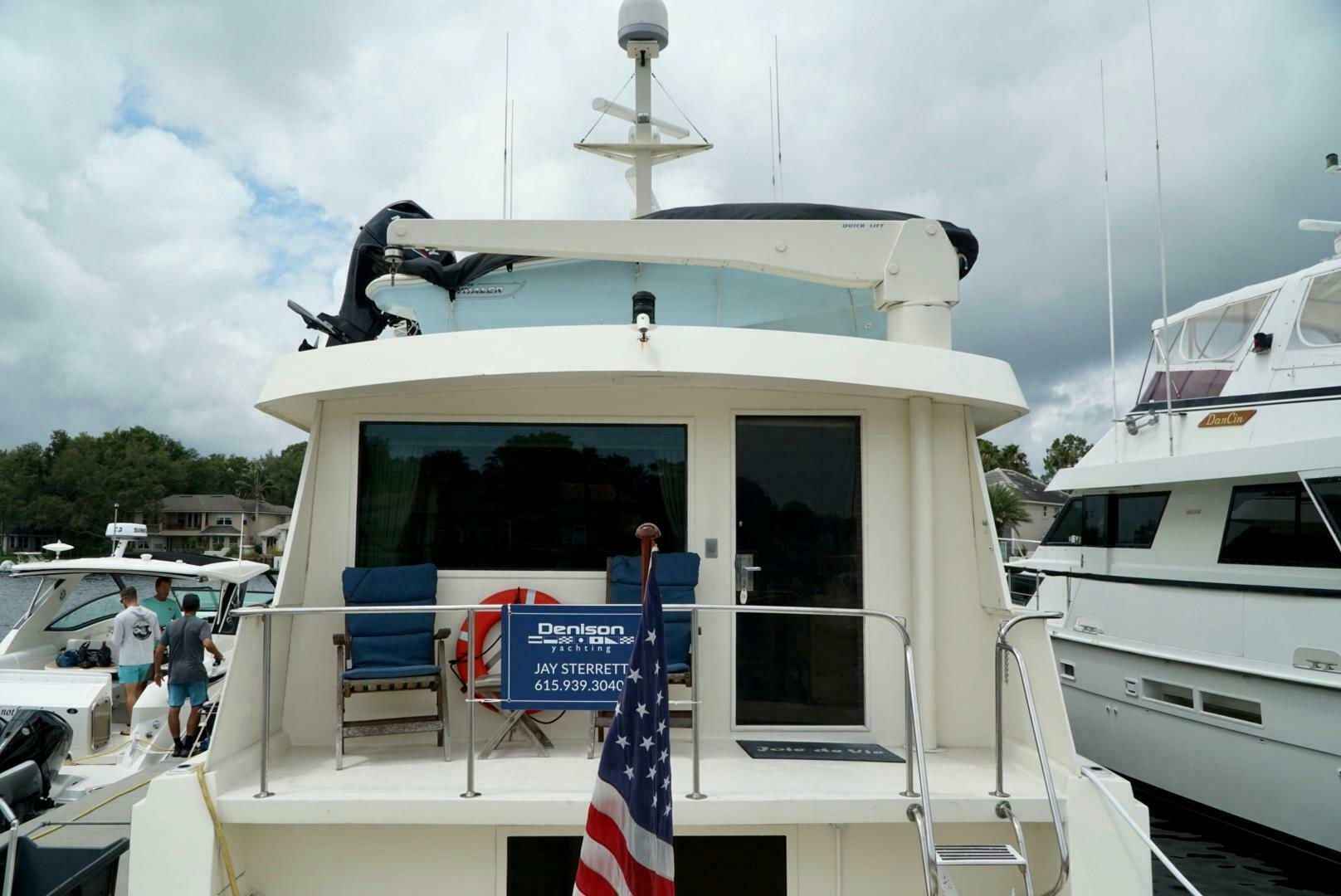 a boat with a flag on the front aboard JOIE DE VIE Yacht for Sale