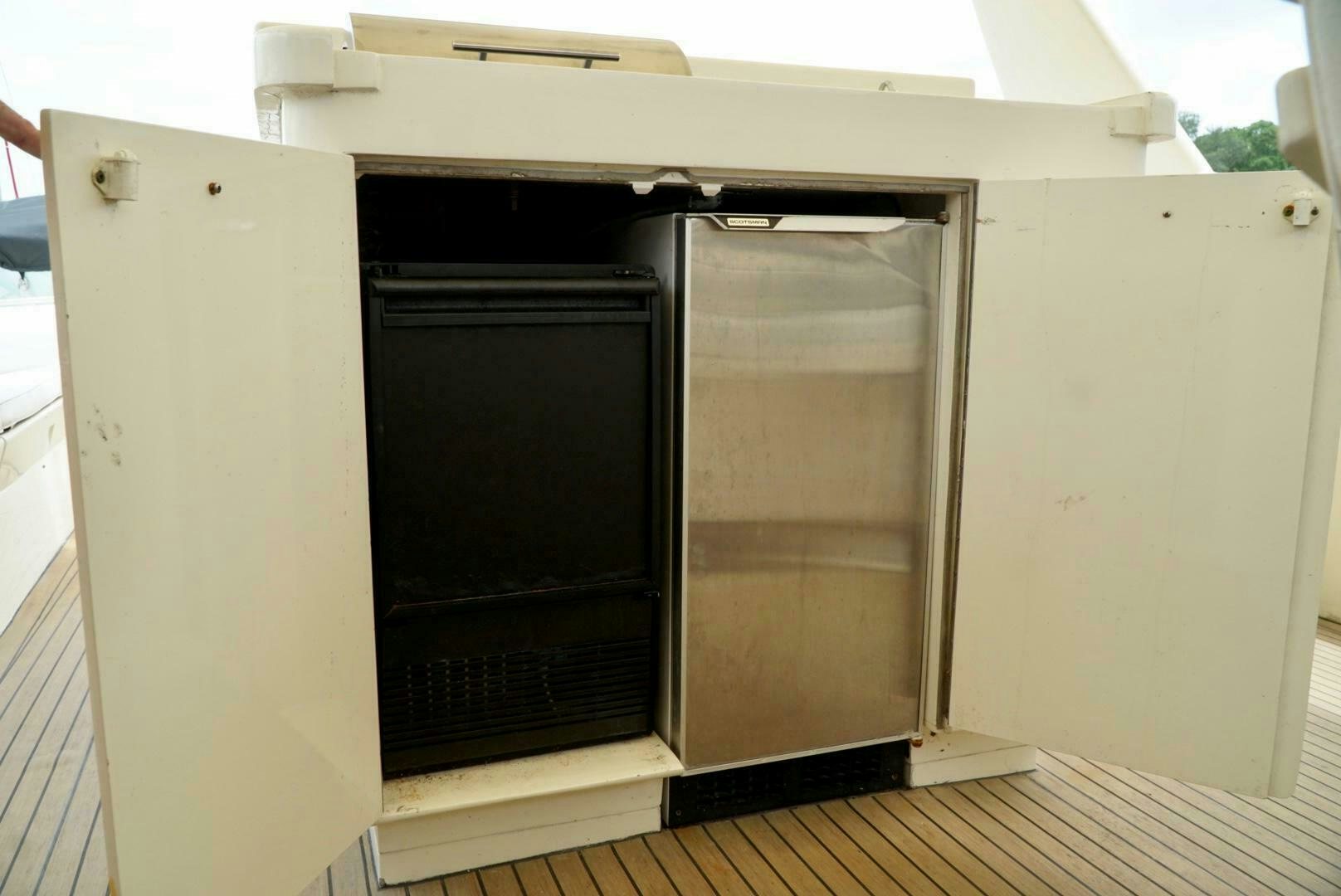 a large refrigerator in a kitchen aboard JOIE DE VIE Yacht for Sale