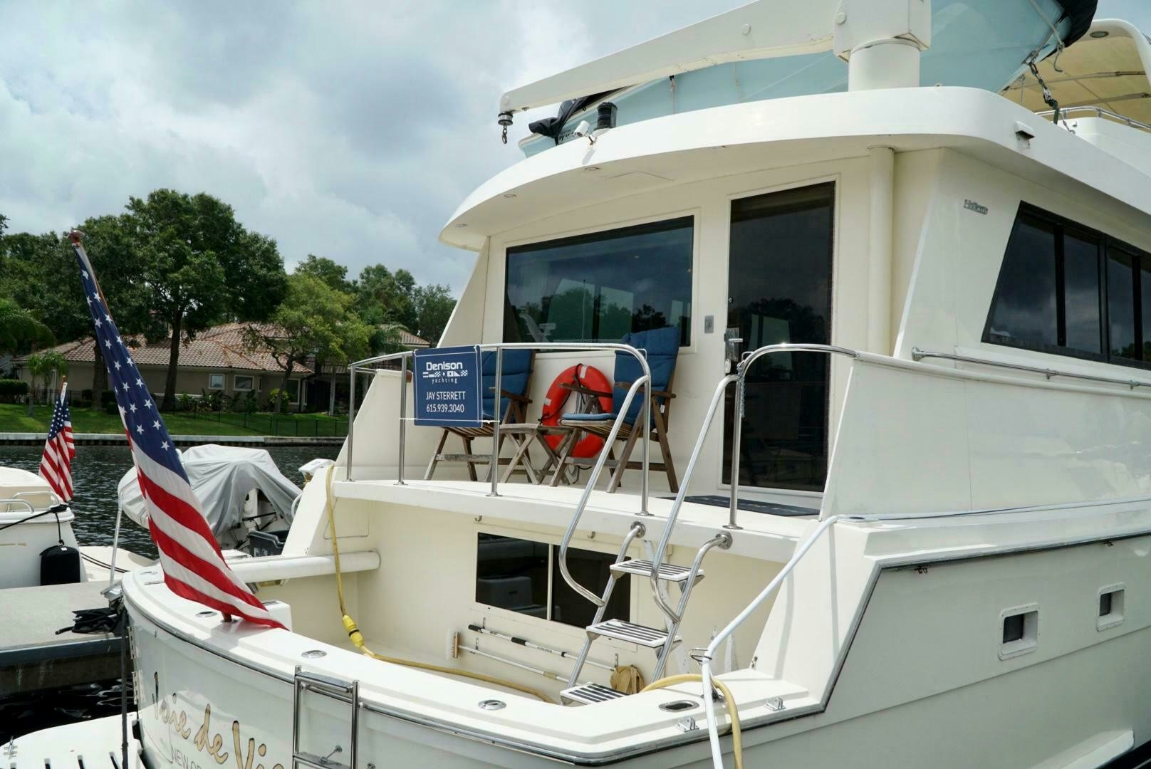 a boat with a flag on the front aboard JOIE DE VIE Yacht for Sale