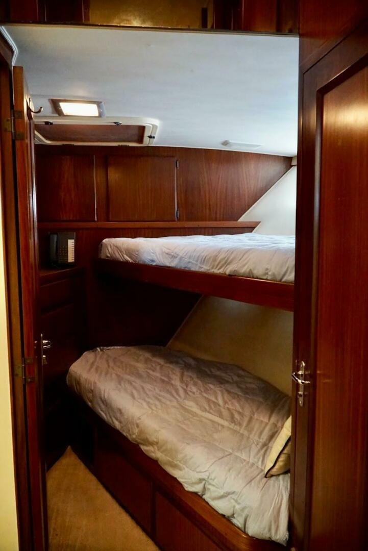 a couple of beds in a room aboard JOIE DE VIE Yacht for Sale