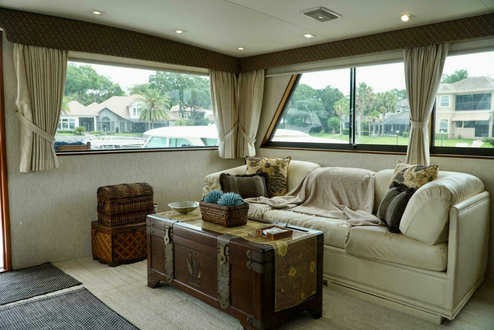 a living room with a couch and a coffee table aboard JOIE DE VIE Yacht for Sale