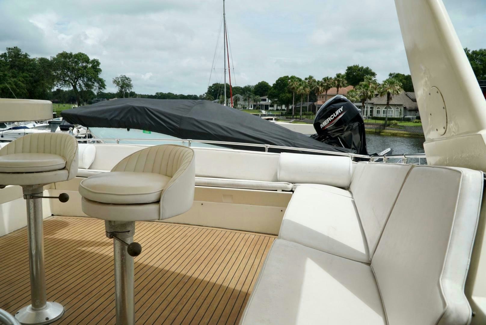 a boat with a chair on the deck aboard JOIE DE VIE Yacht for Sale