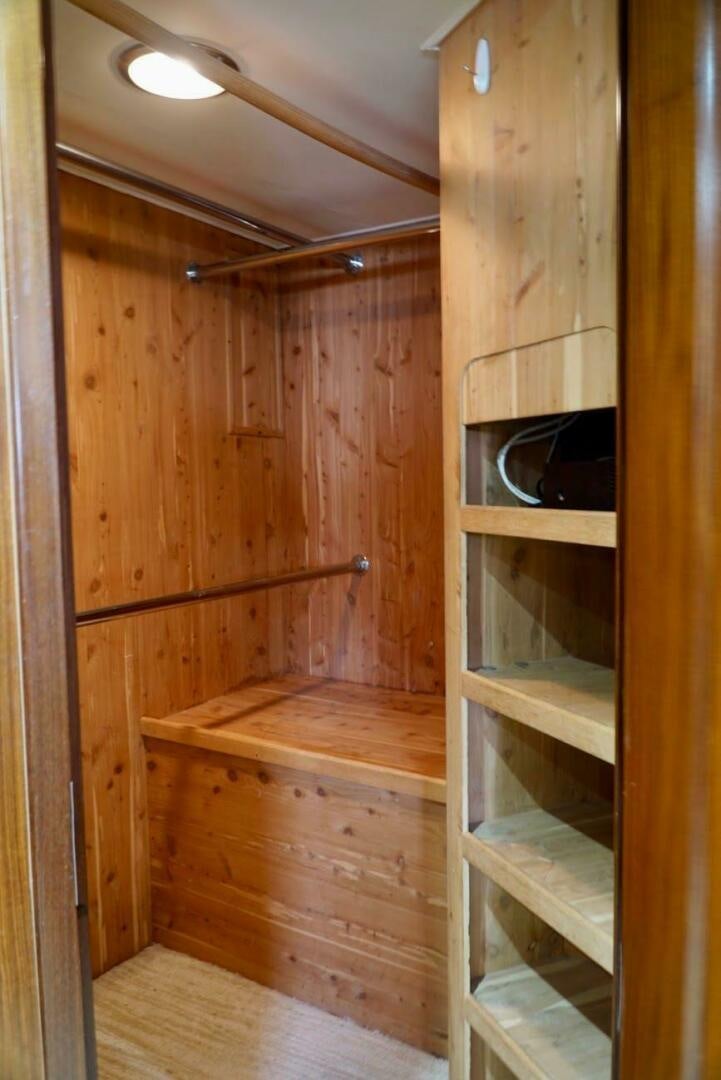 a wooden room with a wood wall and a wood floor aboard JOIE DE VIE Yacht for Sale
