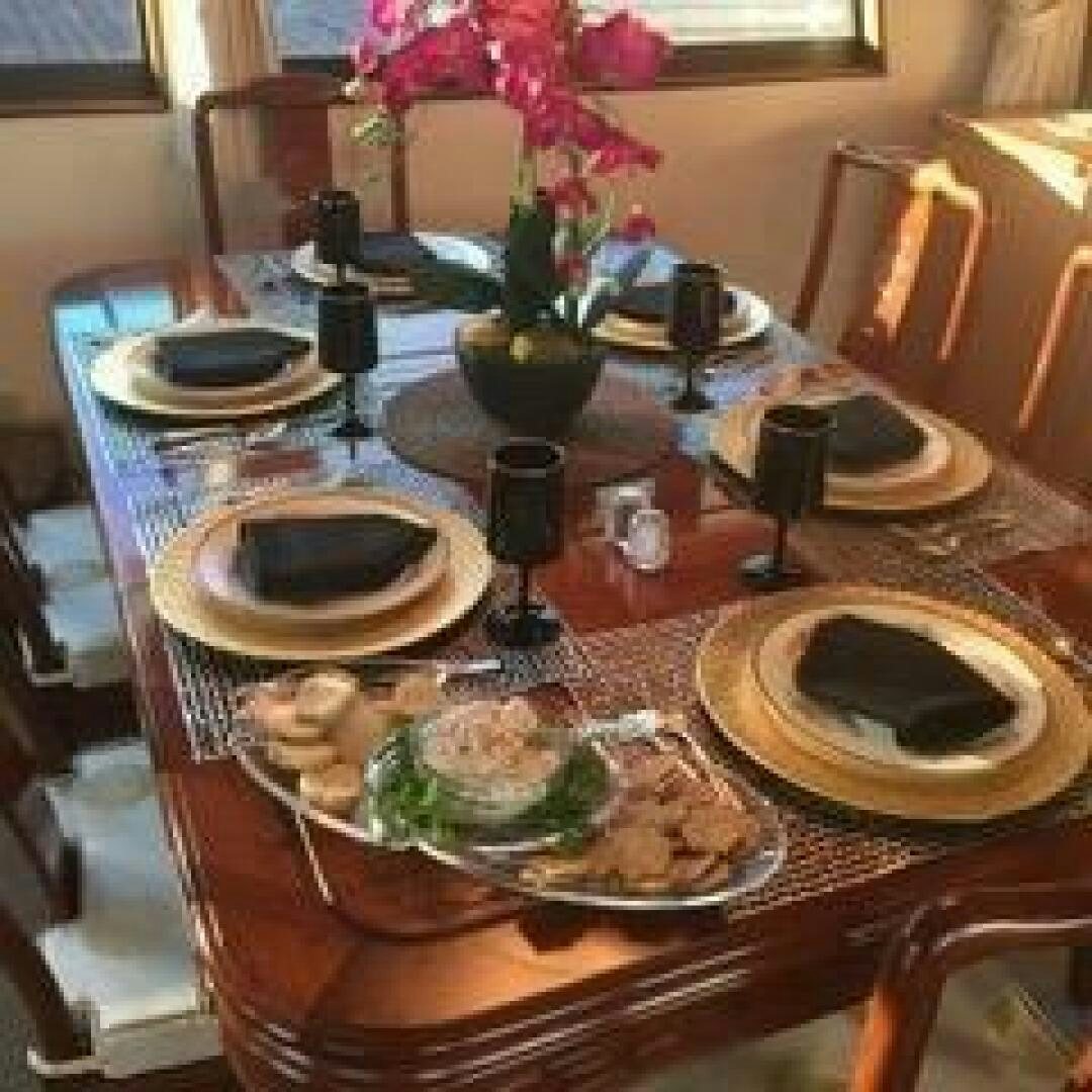 a table with plates and food on it aboard JOIE DE VIE Yacht for Sale