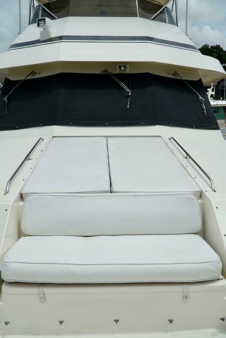 a white car with a hood aboard JOIE DE VIE Yacht for Sale