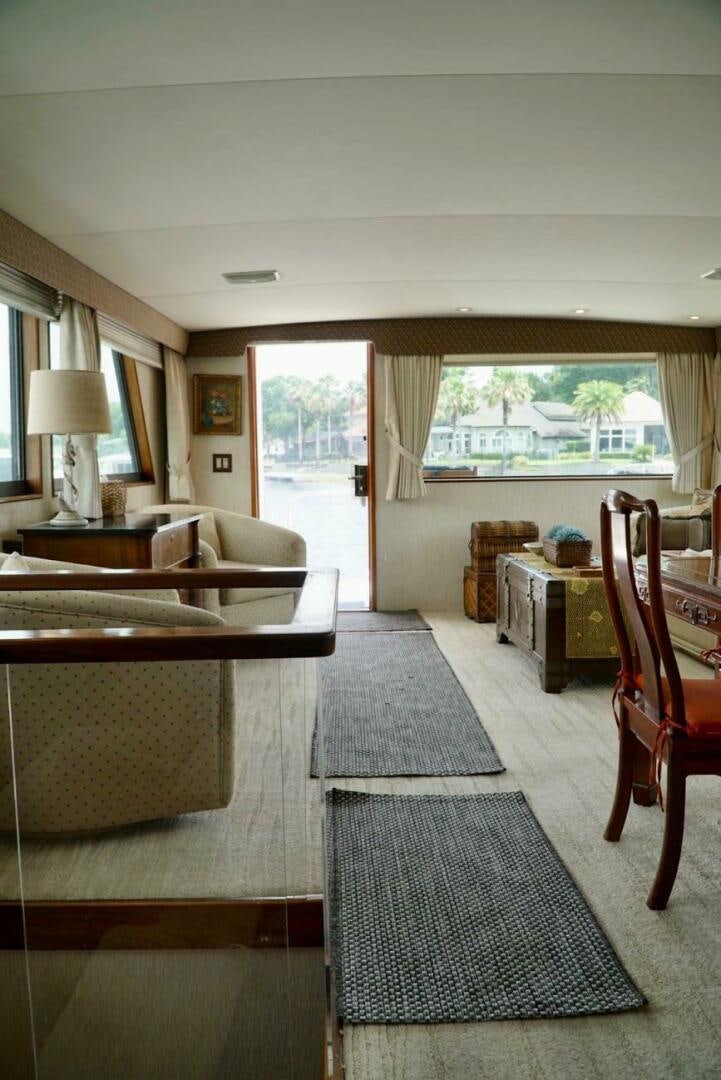 a living room with a couch and a table aboard JOIE DE VIE Yacht for Sale