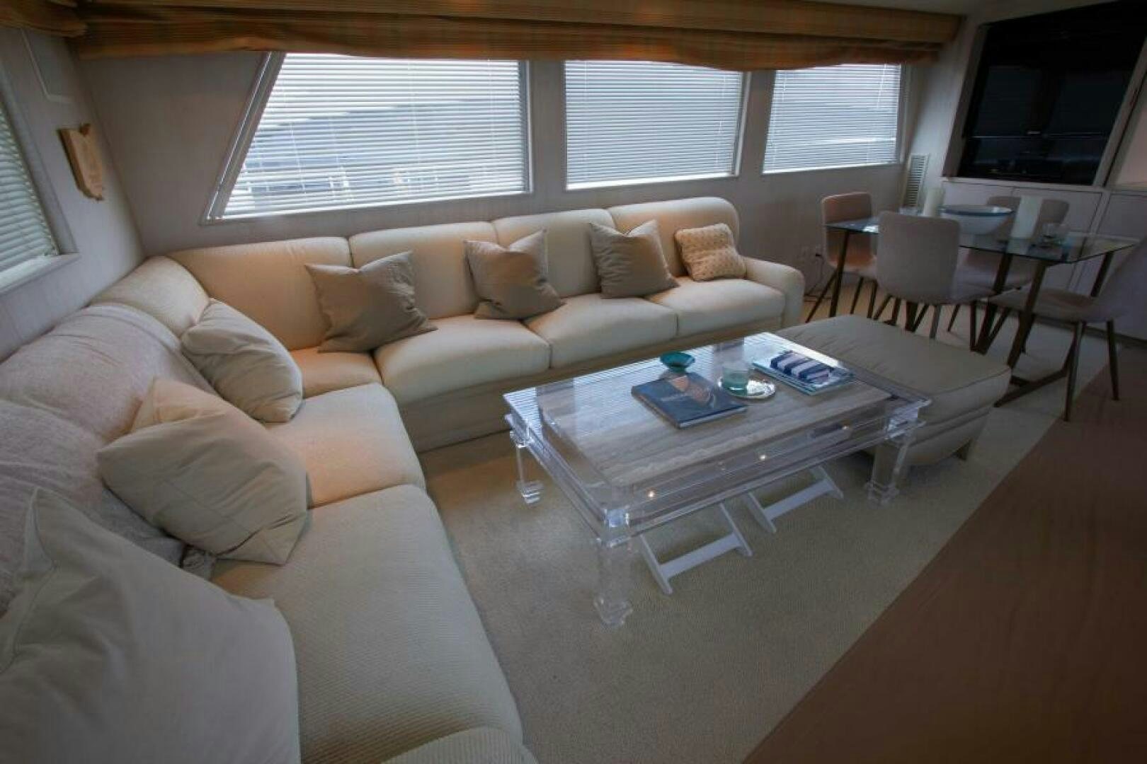 a living room with a couch and a coffee table aboard FULL MOON Yacht for Sale