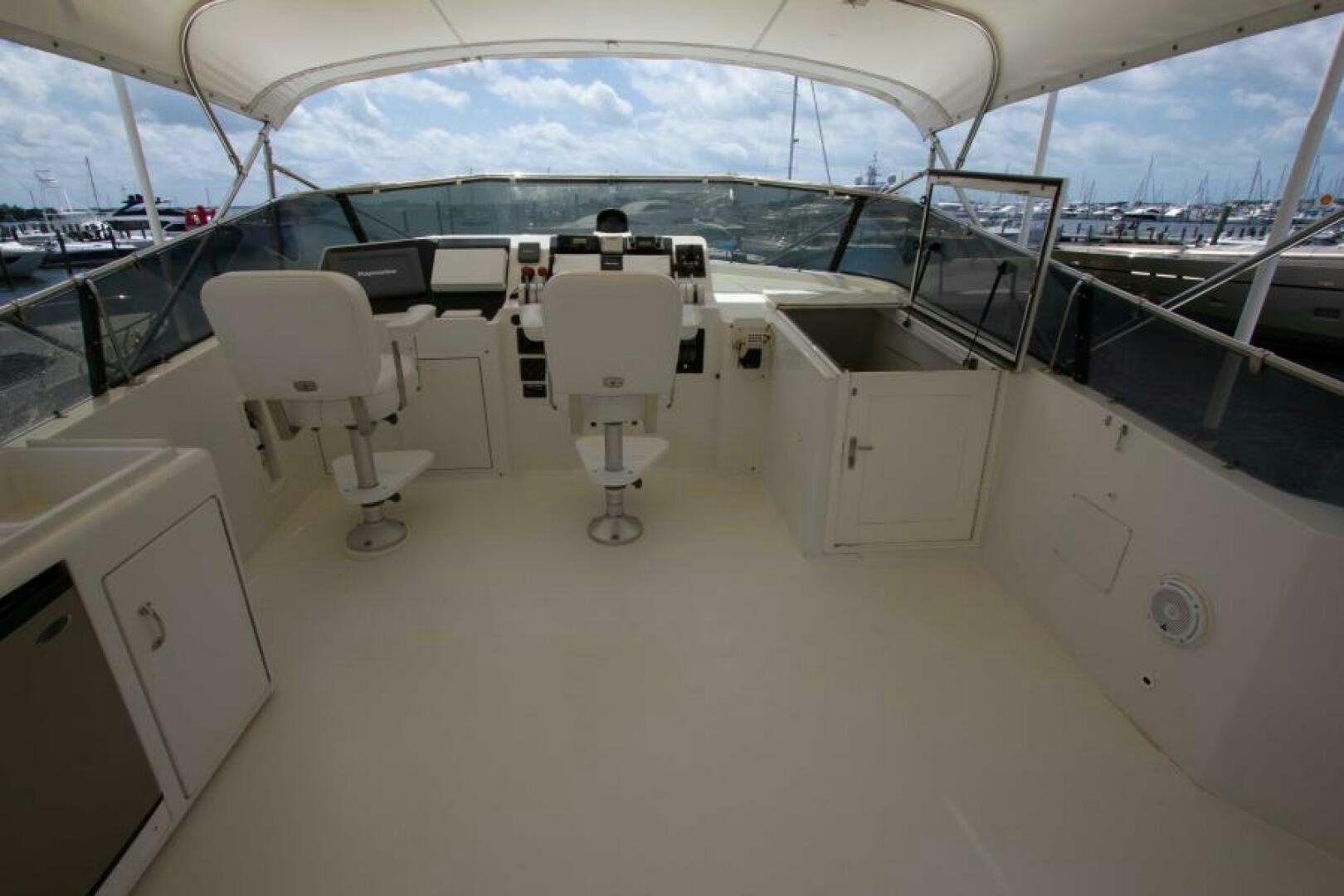 a group of white chairs on a deck aboard FULL MOON Yacht for Sale