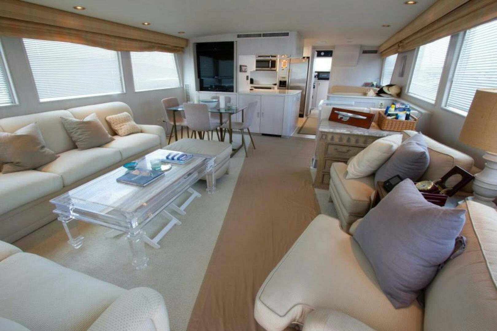 a living room with a couch and a table aboard FULL MOON Yacht for Sale