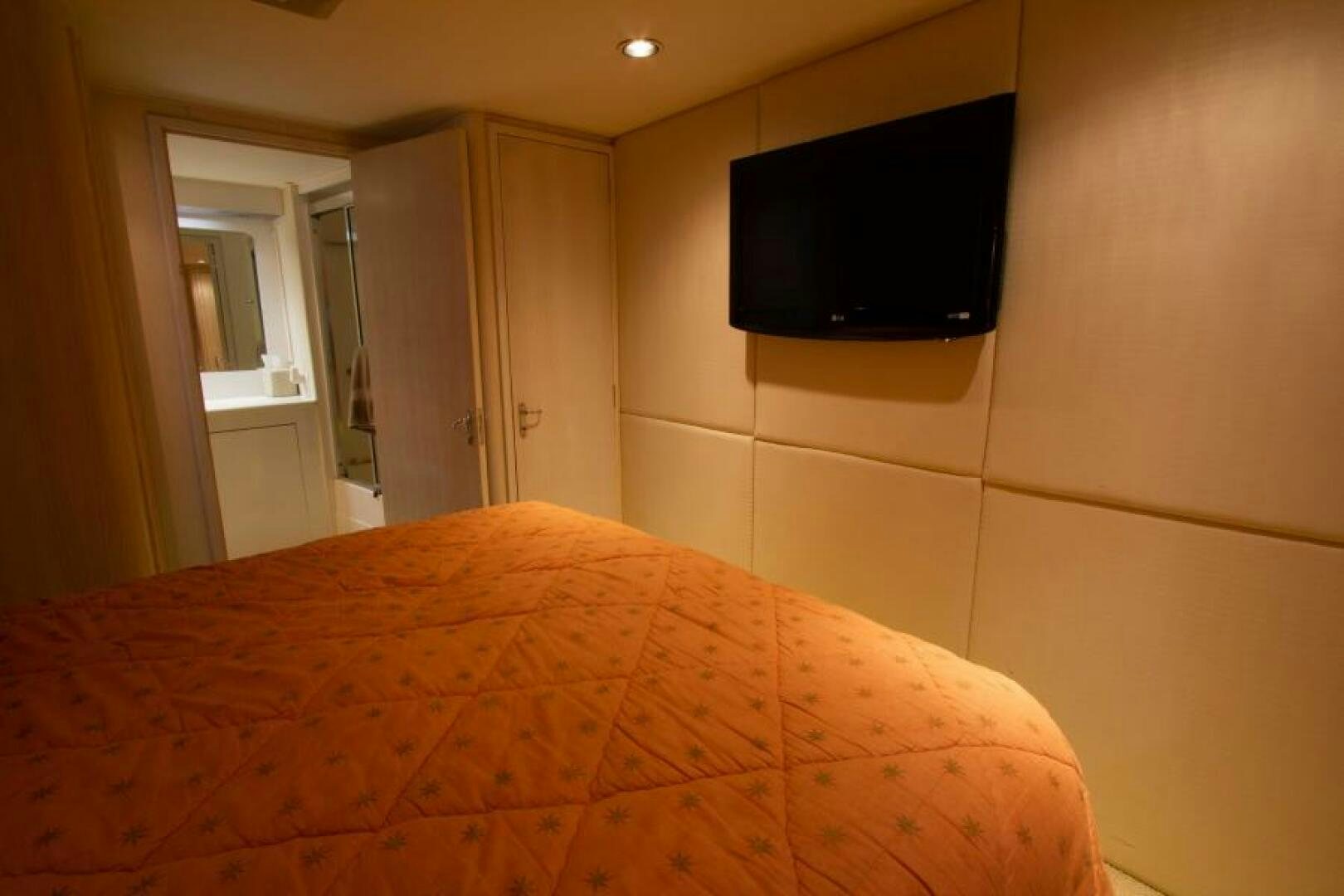 a tv on a wall aboard FULL MOON Yacht for Sale