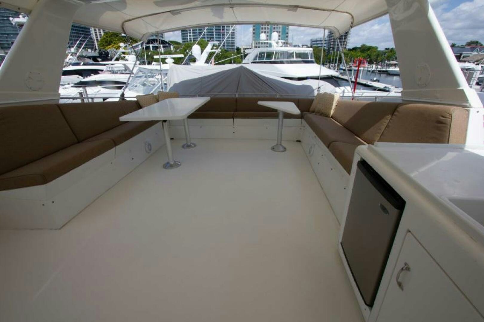 a room with a table and chairs aboard FULL MOON Yacht for Sale