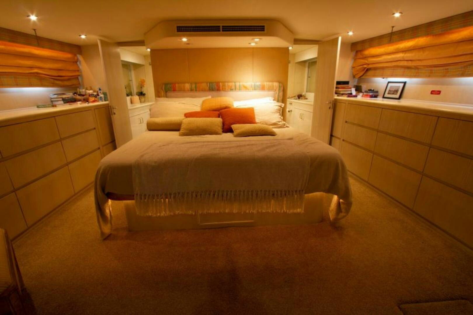 a room with a bed and a desk aboard FULL MOON Yacht for Sale