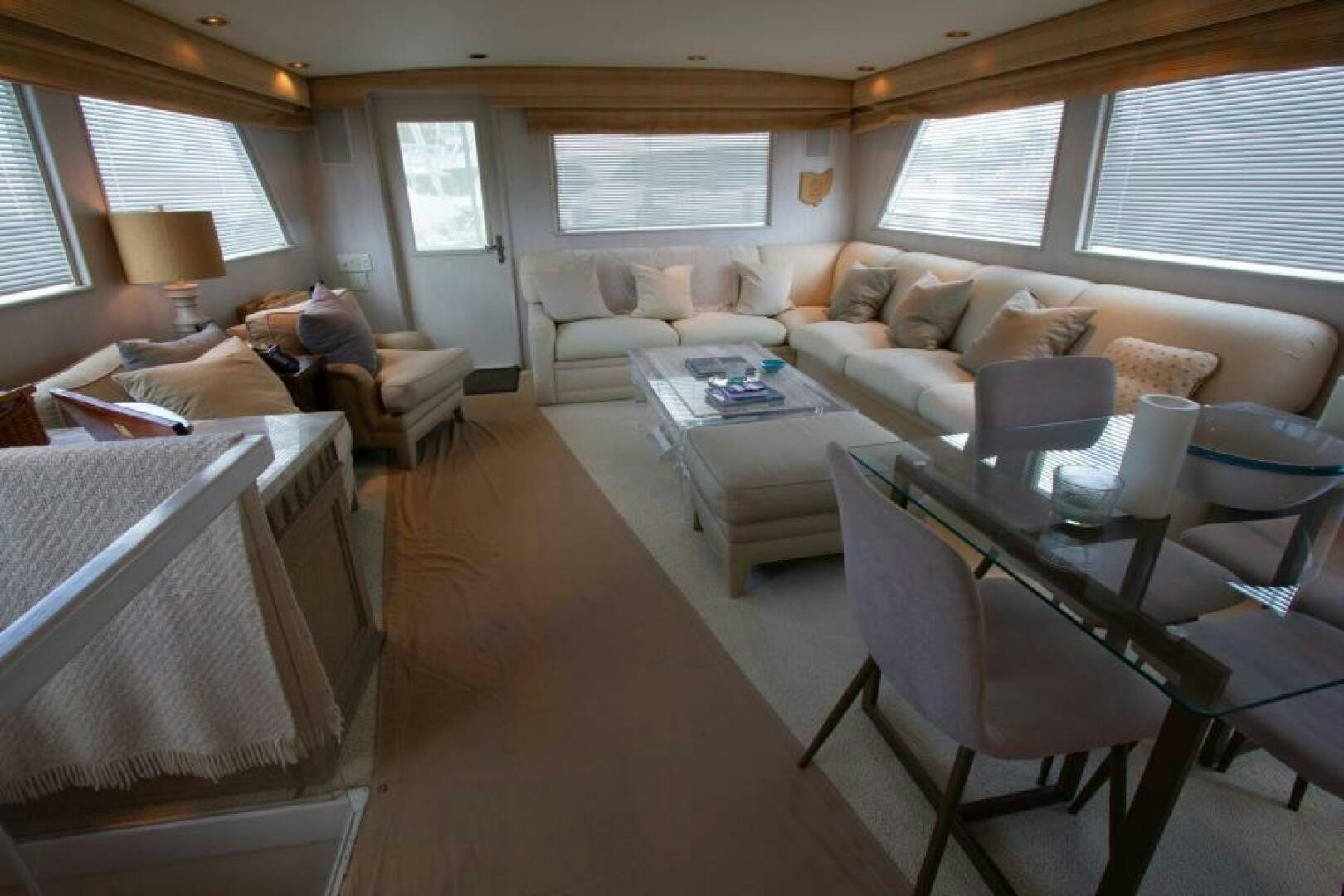 a living room with a couch and a table aboard FULL MOON Yacht for Sale