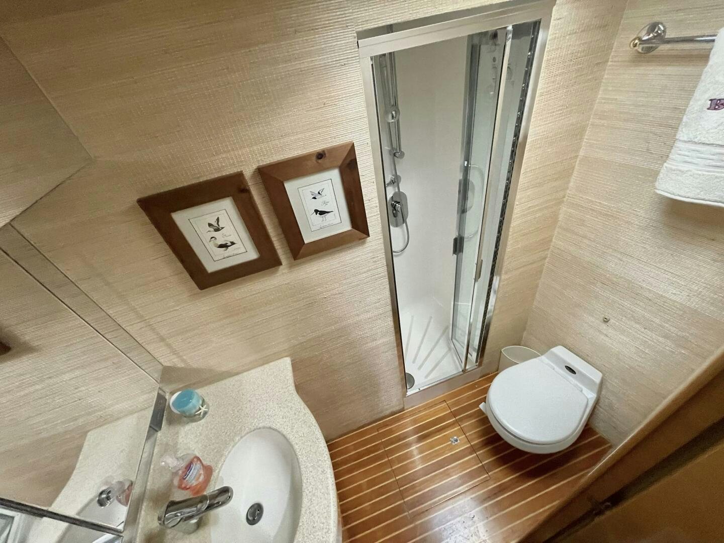 a bathroom with a toilet and sink aboard BOATOX Yacht for Sale