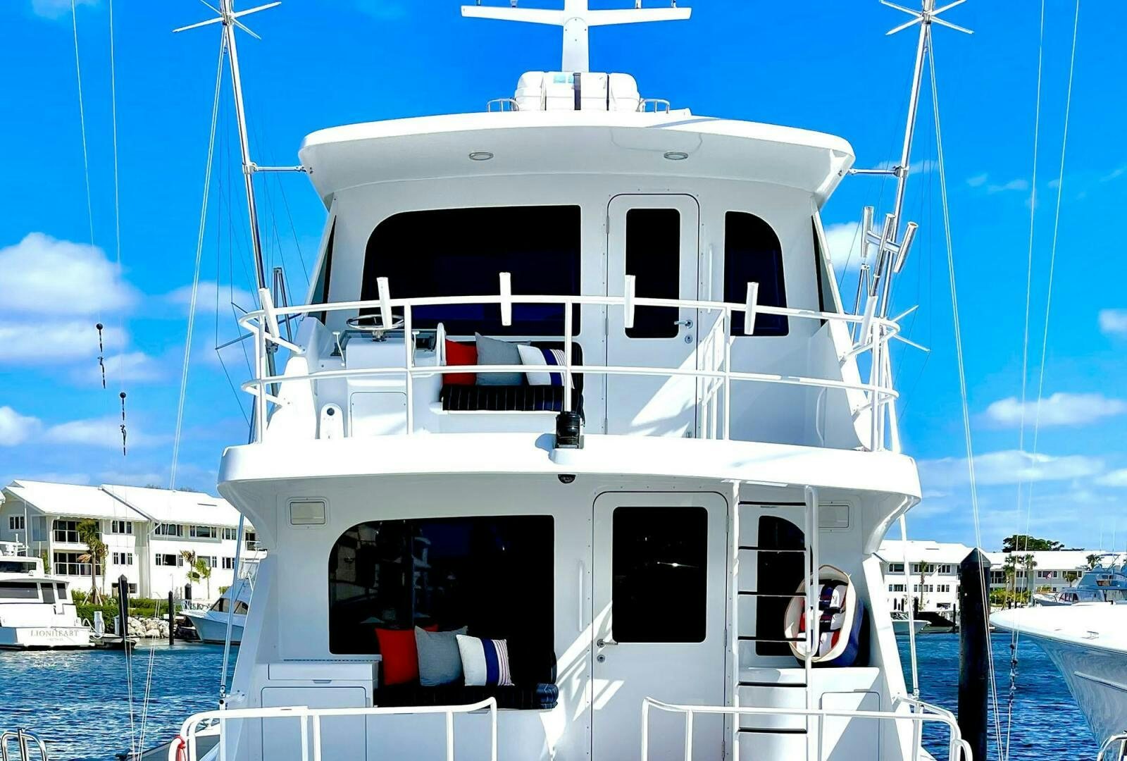 a white boat with a white stripe aboard BOATOX Yacht for Sale