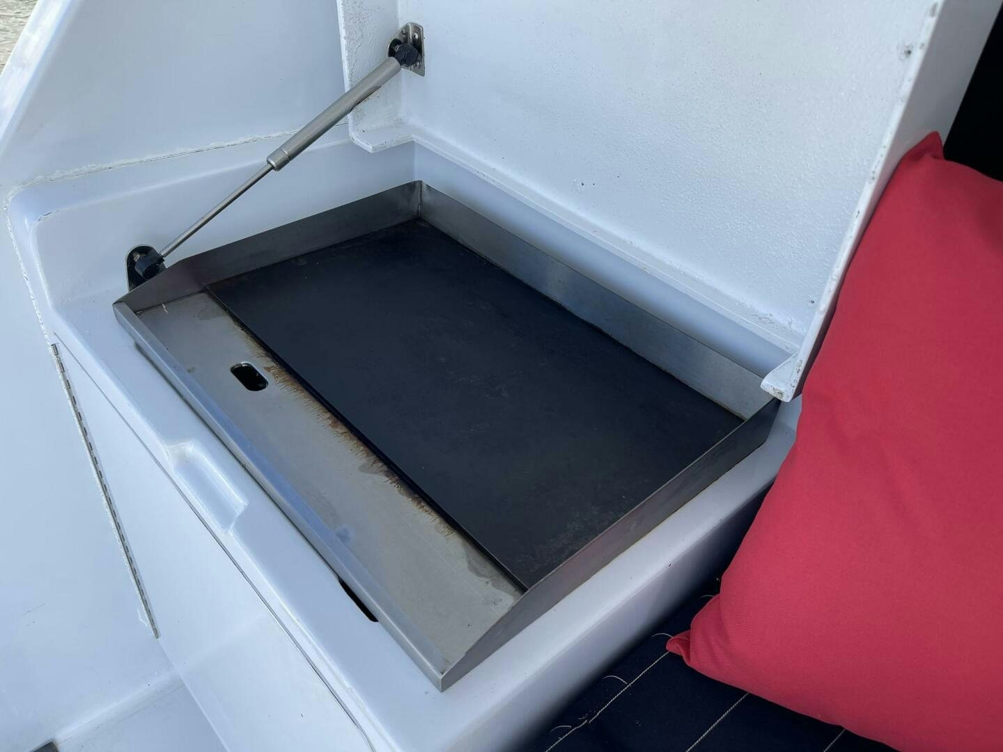 a white cabinet with a black mat aboard BOATOX Yacht for Sale