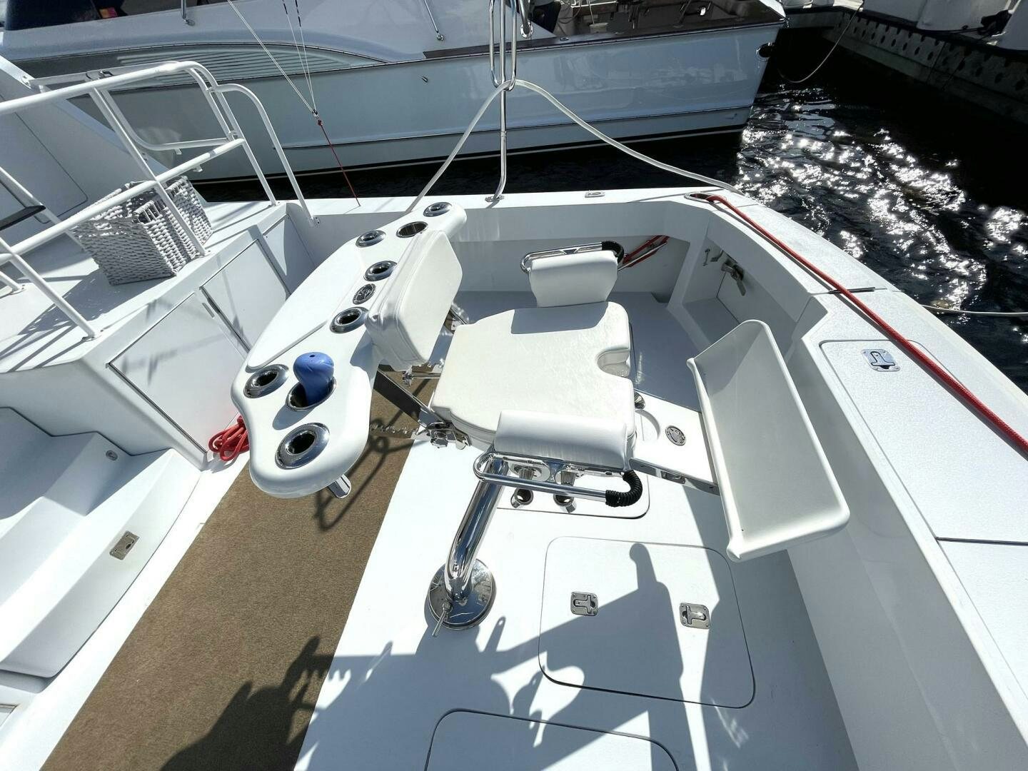 a white boat with a white boat in the background aboard BOATOX Yacht for Sale