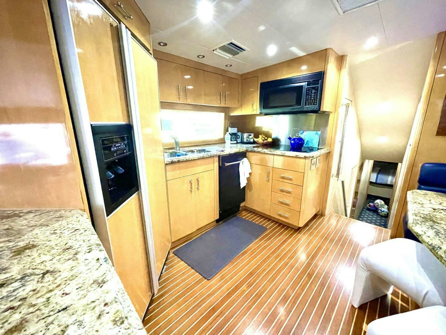 a kitchen with a microwave oven and a countertop aboard BOATOX Yacht for Sale