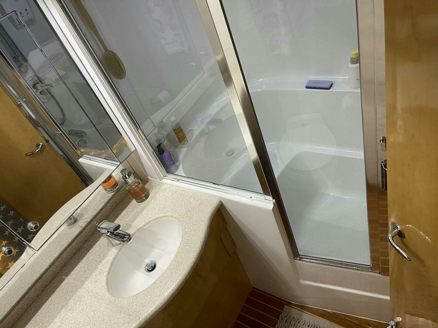 a bathroom with a sink and a shower aboard BOATOX Yacht for Sale