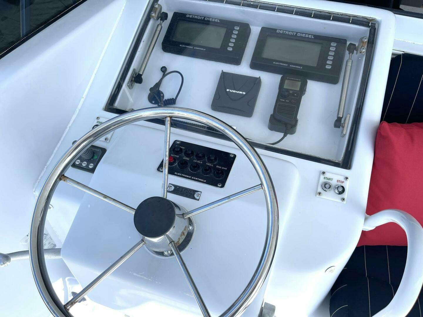 a white car with a black steering wheel aboard BOATOX Yacht for Sale