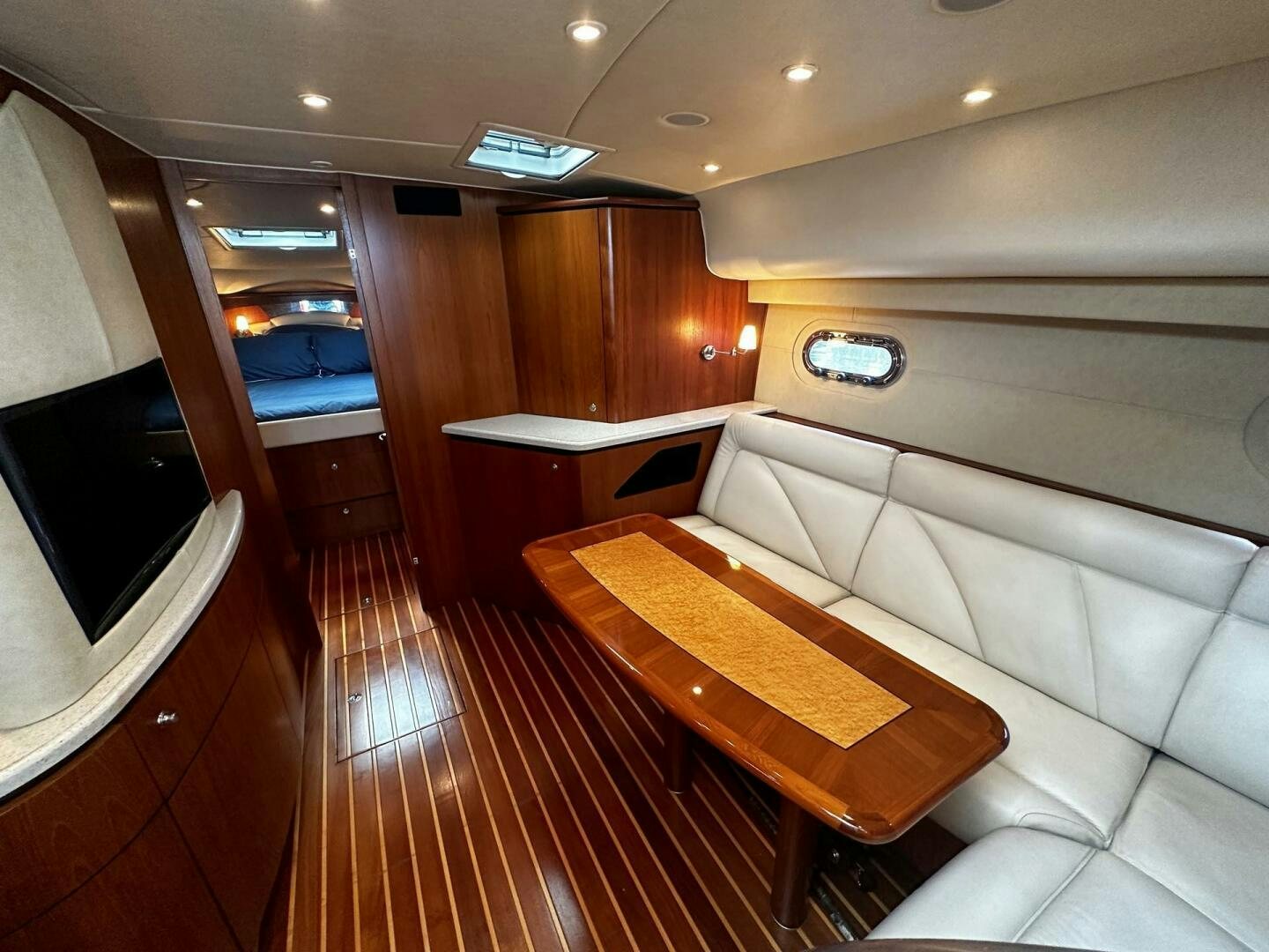 a room with a table and chairs aboard CRYSTAL II Yacht for Sale