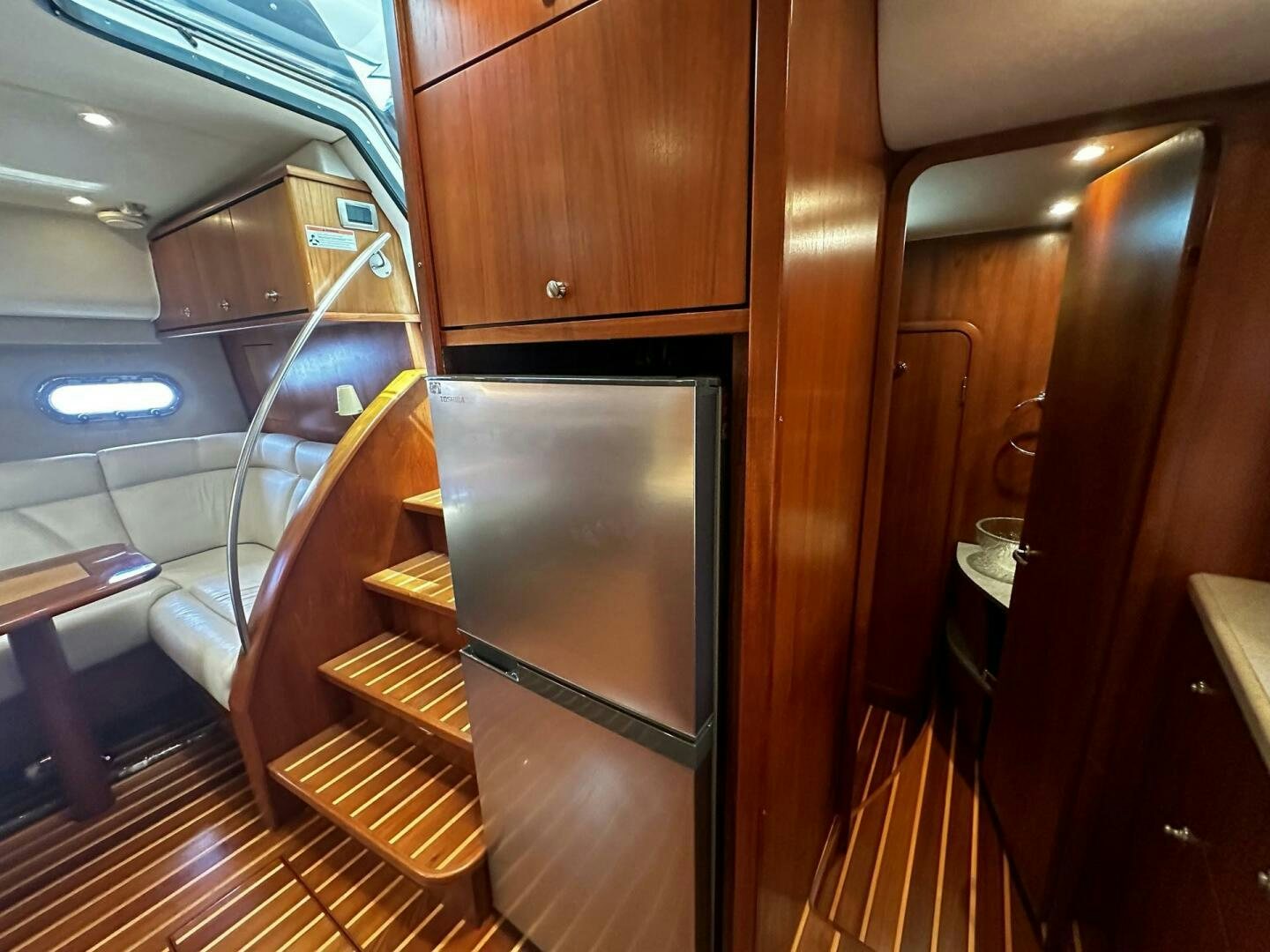 a room with a staircase and a glass door aboard CRYSTAL II Yacht for Sale