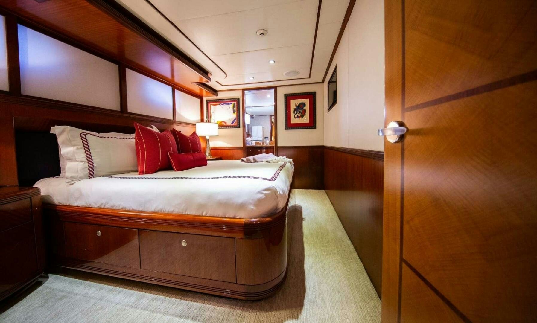 a bed in a room aboard JUST ENOUGH Yacht for Sale