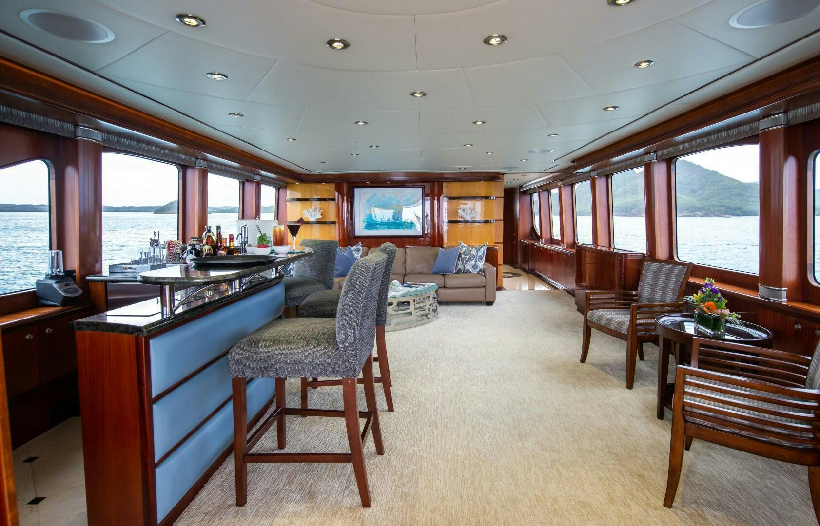 a large living room with a kitchen and dining area aboard JUST ENOUGH Yacht for Sale