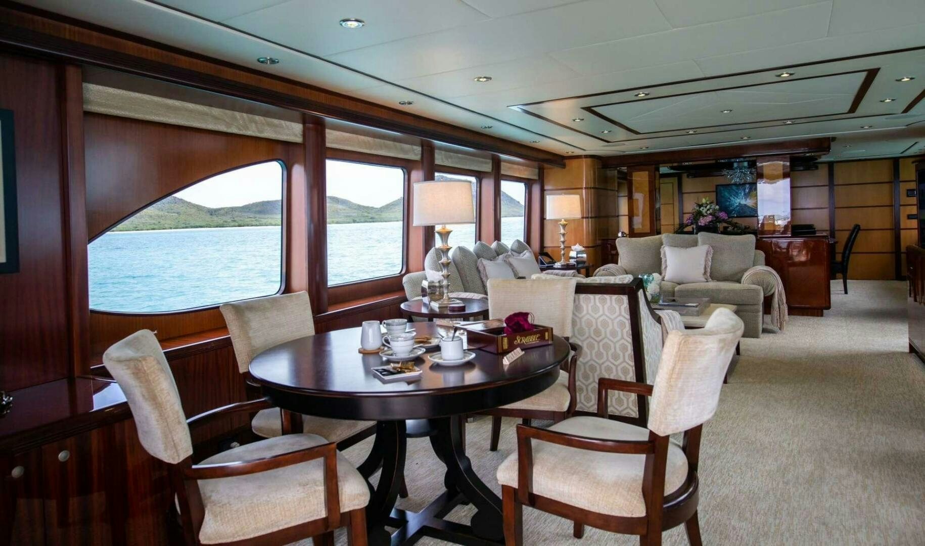 a dining room with a table and chairs aboard JUST ENOUGH Yacht for Sale