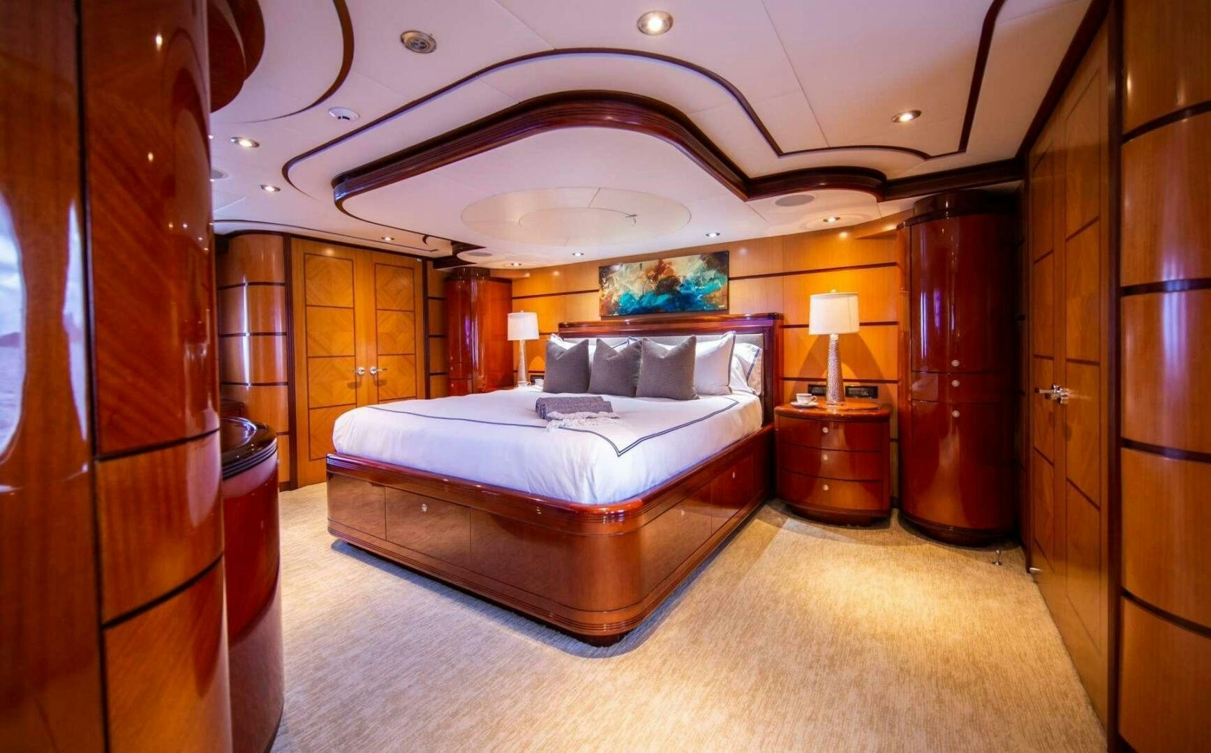 a bedroom with a large bed aboard JUST ENOUGH Yacht for Sale