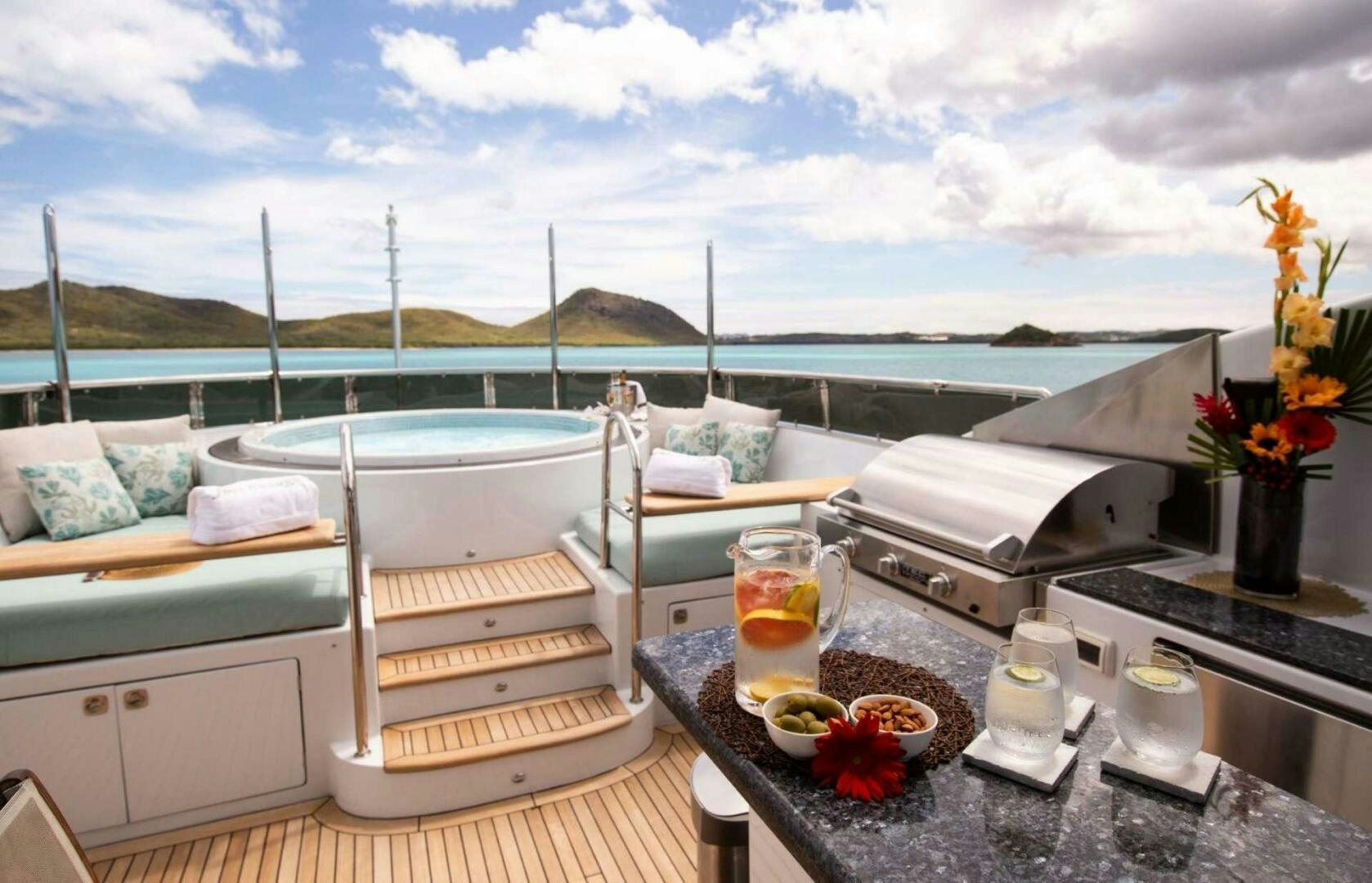 a balcony with a view of the ocean and the ocean aboard JUST ENOUGH Yacht for Sale