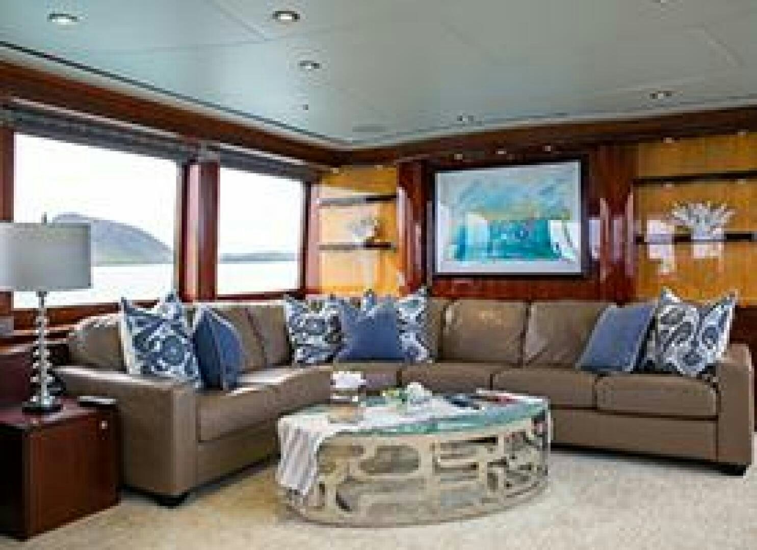 a living room with a large sofa aboard JUST ENOUGH Yacht for Sale