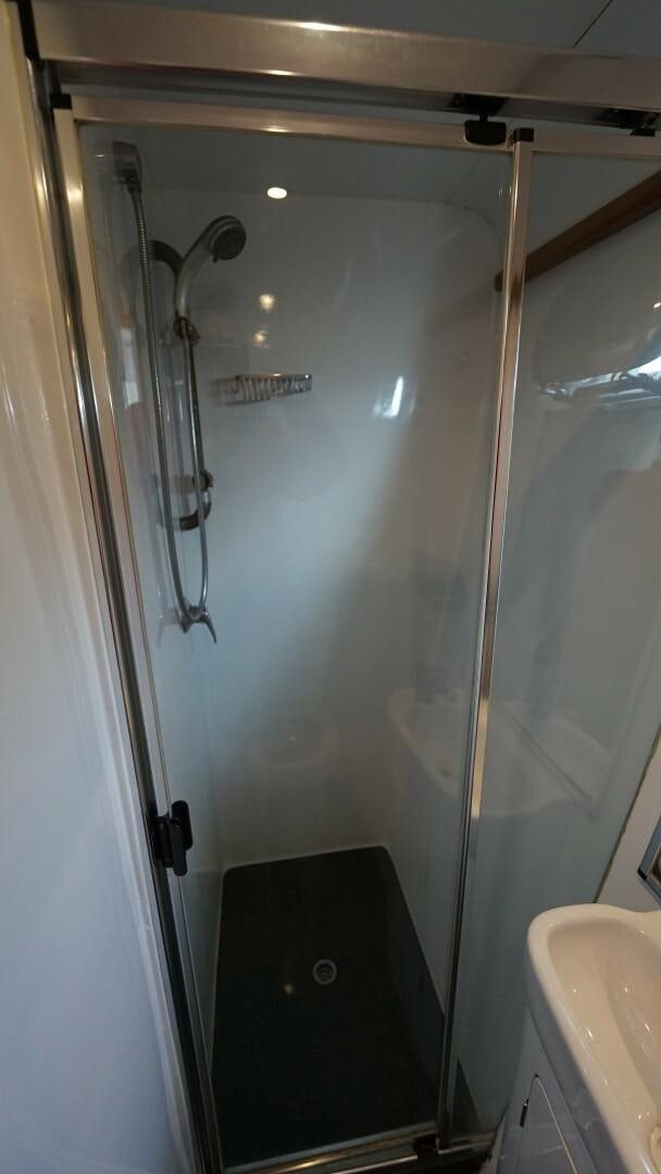 a shower with a shower head aboard SOVEREIGN Yacht for Sale