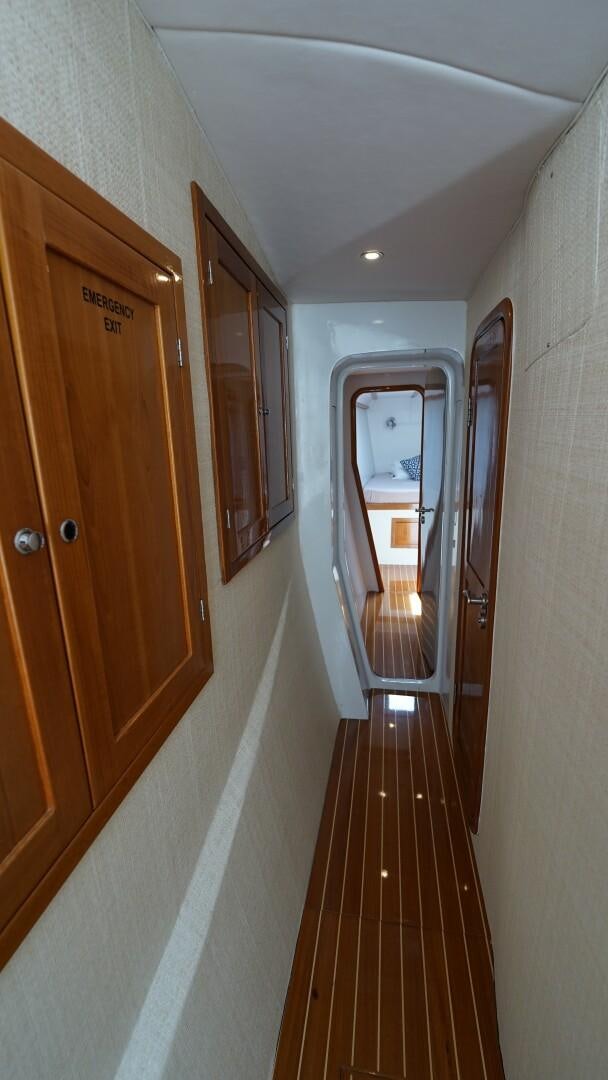 a hallway with doors aboard SOVEREIGN Yacht for Sale